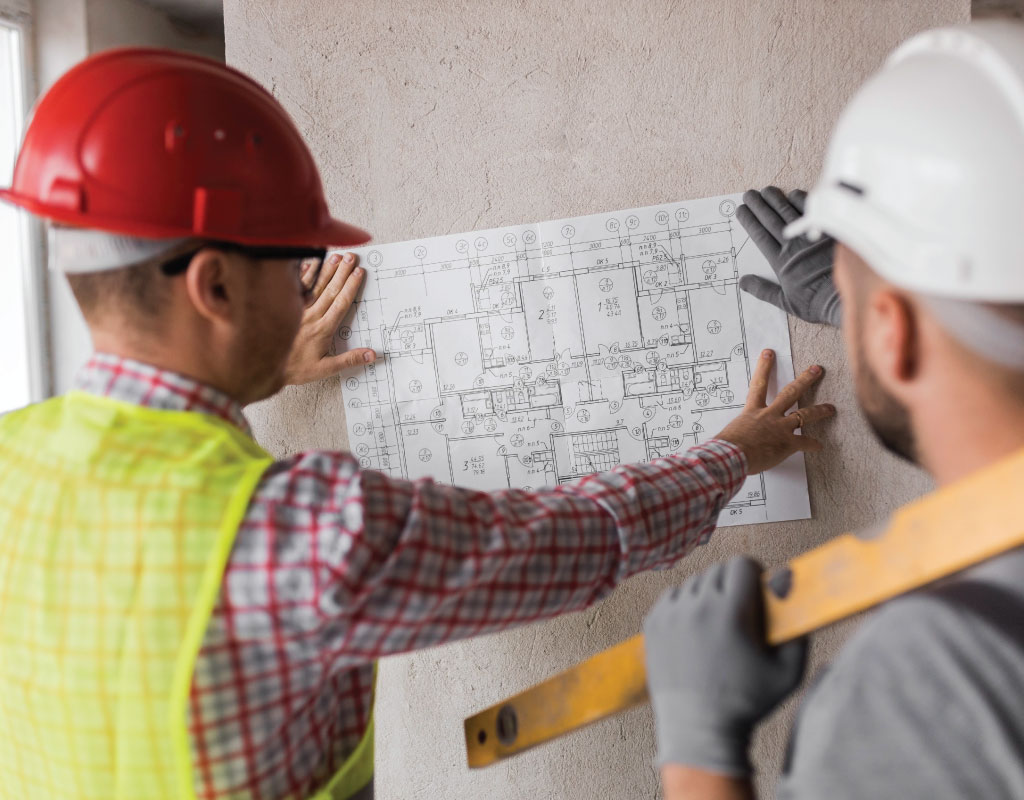 Two workers are discussing project